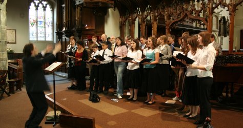 Peter Siepmann rehearses the choir of St Peter's Church, Nottingham